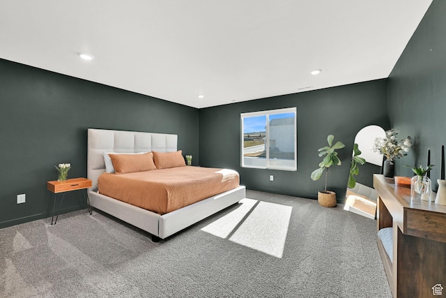 carpeted bedroom featuring baseboards and recessed lighting