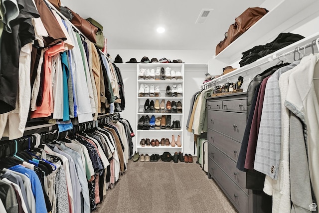 spacious closet featuring visible vents and carpet