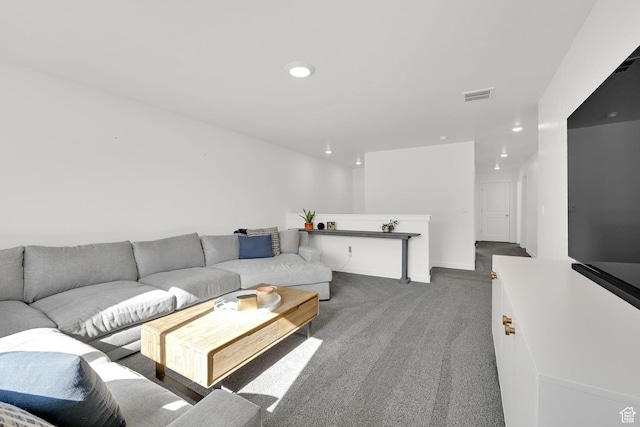 living room featuring carpet floors, recessed lighting, and visible vents