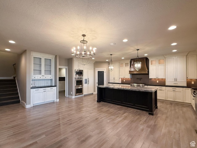 1663 N 3500 W, Plain City, UT 84404 - kitchen with stainless steel appliances, recessed lighting, custom range hood, white cabinetry, and wood finished floors