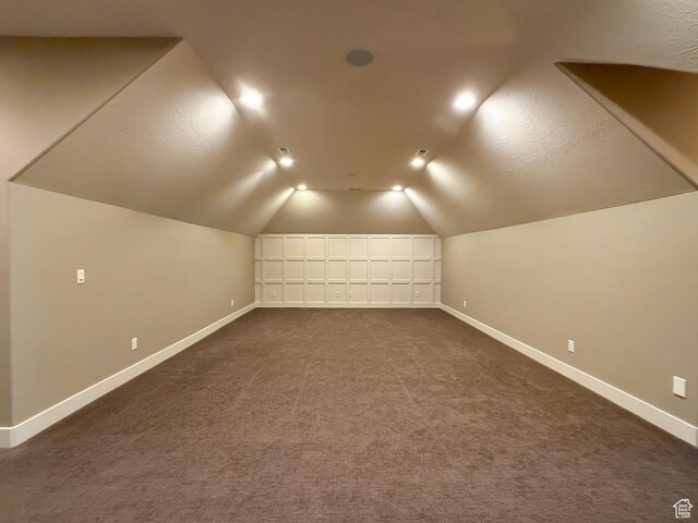 1663 N 3500 W, Plain City, UT 84404 - bonus room featuring dark carpet, vaulted ceiling, and baseboards