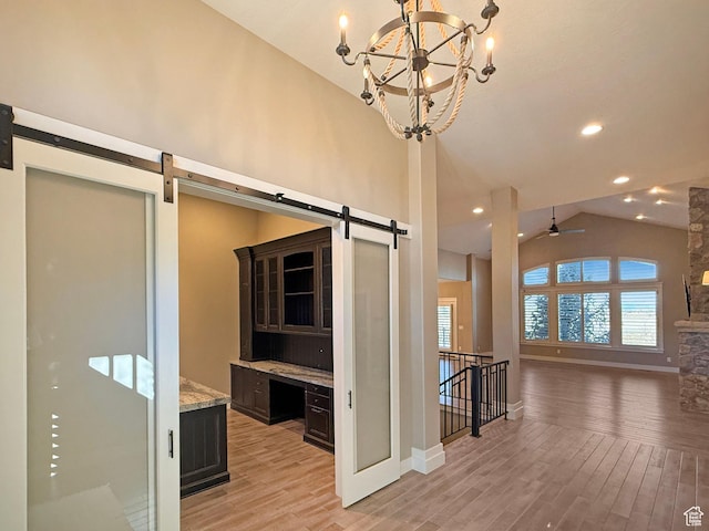 1663 N 3500 W, Plain City, UT 84404 - hall with high vaulted ceiling, a barn door, recessed lighting, baseboards, and light wood-style floors