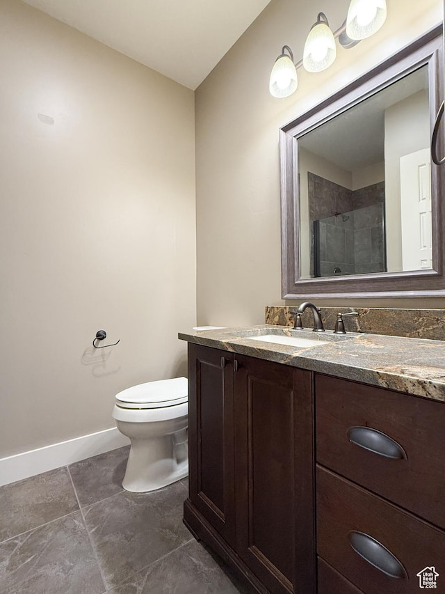 1663 N 3500 W, Plain City, UT 84404 - bathroom with baseboards, toilet, tile patterned flooring, an enclosed shower, and vanity