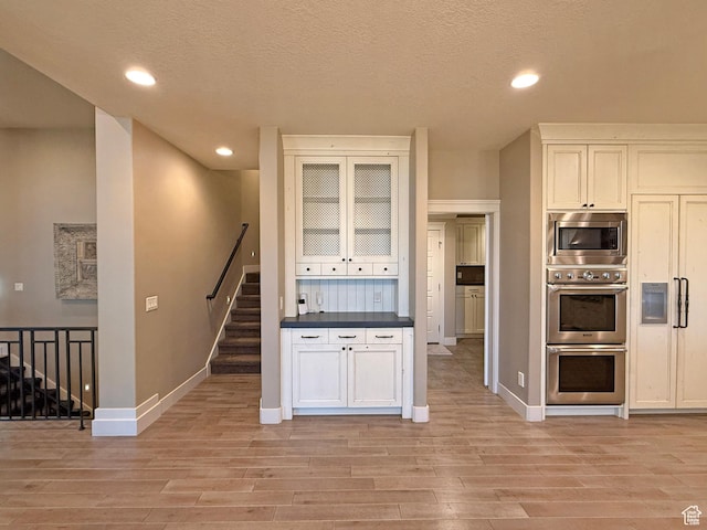 1663 N 3500 W, Plain City, UT 84404 - kitchen with stainless steel appliances, recessed lighting, light wood-type flooring, and baseboards