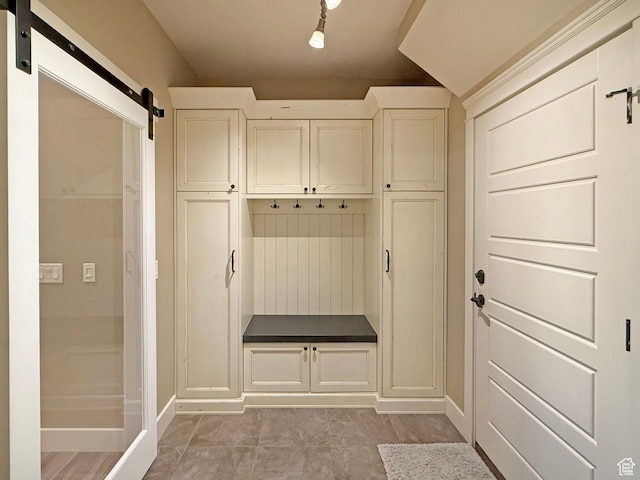 1663 N 3500 W, Plain City, UT 84404 - mudroom featuring baseboards and a barn door