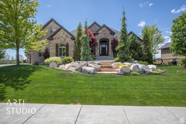 1663 N 3500 W, Plain City, UT 84404 - french country inspired facade with stone siding, a front lawn, and central AC unit