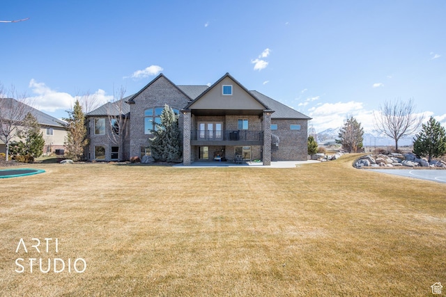 1663 N 3500 W, Plain City, UT 84404 - view of front facade featuring brick siding, a patio, a balcony, and a front lawn