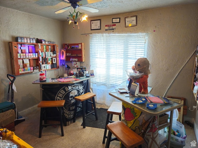 613 Jefferson St, Montpelier, ID 83254 - home office with a textured wall, a ceiling fan, a textured ceiling, carpet flooring, and a dry bar