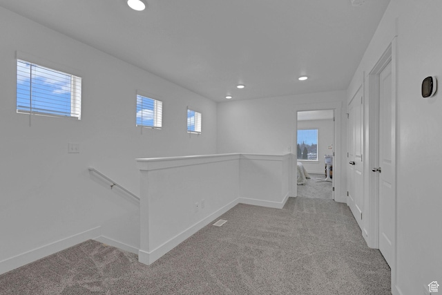 1189 W 1820 S Unit 13, Logan, UT 84321 - corridor featuring an upstairs landing, carpet flooring, recessed lighting, and plenty of natural light