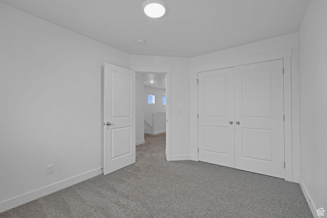 1189 W 1820 S Unit 13, Logan, UT 84321 - unfurnished bedroom featuring carpet, baseboards, and a closet