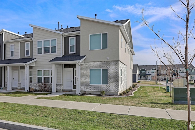1189 W 1820 S Unit 13, Logan, UT 84321 - townhome / multi-family property with a front lawn and a residential view