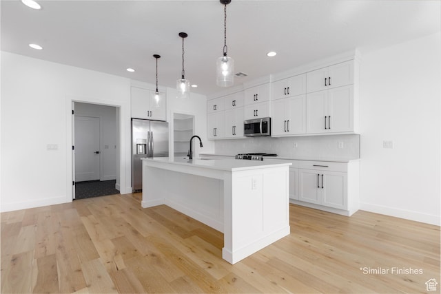 4085 E El Capitan Way, St George, UT 84790 - kitchen featuring white cabinets, light countertops, appliances with stainless steel finishes, recessed lighting, and light wood-style flooring
