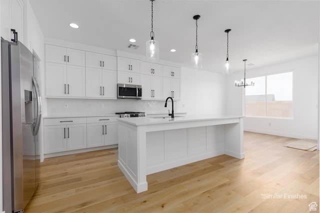 4085 E El Capitan Way, St George, UT 84790 - kitchen featuring visible vents, a sink, light countertops, light wood-style floors, and stainless steel appliances