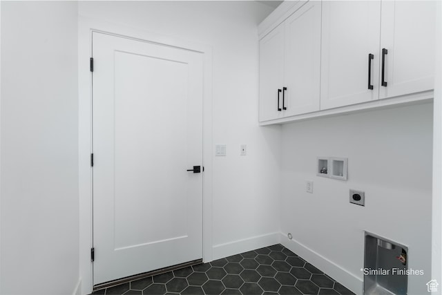 4085 E El Capitan Way, St George, UT 84790 - washroom with dark tile patterned floors, electric dryer hookup, baseboards, washer hookup, and cabinet space