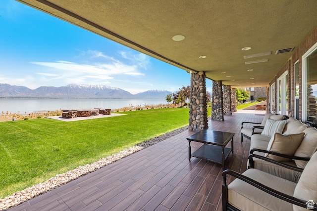 1698 S Amanda Ln E, Saratoga Springs, UT 84045 - view of patio featuring visible vents, an outdoor living space, and a water and mountain view