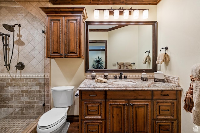 1698 S Amanda Ln E, Saratoga Springs, UT 84045 - full bathroom featuring tiled shower, crown molding, vanity, and toilet