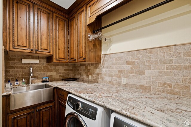 1698 S Amanda Ln E, Saratoga Springs, UT 84045 - washroom with washer / clothes dryer, cabinet space, and a sink