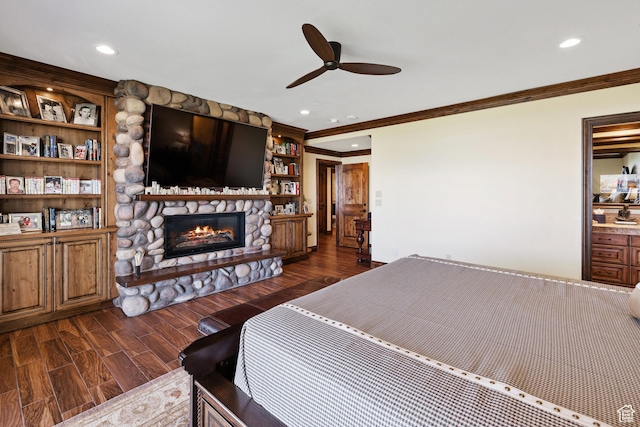 1698 S Amanda Ln E, Saratoga Springs, UT 84045 - bedroom with dark wood finished floors, a ceiling fan, crown molding, a stone fireplace, and recessed lighting