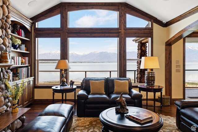 1698 S Amanda Ln E, Saratoga Springs, UT 84045 - living room featuring dark wood finished floors, vaulted ceiling, baseboards, and a water and mountain view