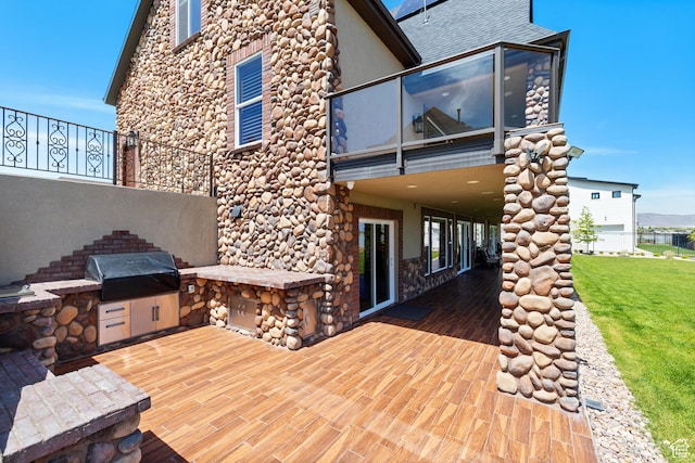 1698 S Amanda Ln E, Saratoga Springs, UT 84045 - rear view of house featuring a yard, exterior kitchen, a balcony, and stucco siding