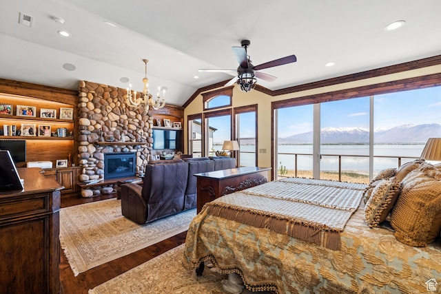 1698 S Amanda Ln E, Saratoga Springs, UT 84045 - bedroom featuring access to exterior, visible vents, vaulted ceiling, a stone fireplace, and wood finished floors