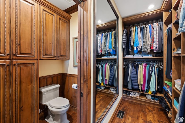 1698 S Amanda Ln E, Saratoga Springs, UT 84045 - bathroom featuring a wainscoted wall, visible vents, toilet, and wood finished floors