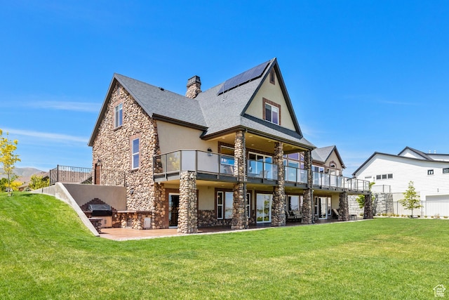 1698 S Amanda Ln E, Saratoga Springs, UT 84045 - rear view of property with stone siding, a chimney, a yard, a patio area, and stucco siding