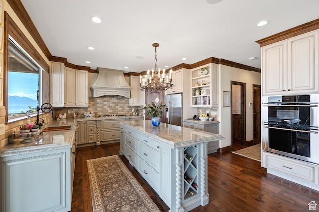 1698 S Amanda Ln E, Saratoga Springs, UT 84045 - kitchen with dark wood-style floors, open shelves, custom range hood, appliances with stainless steel finishes, and a sink