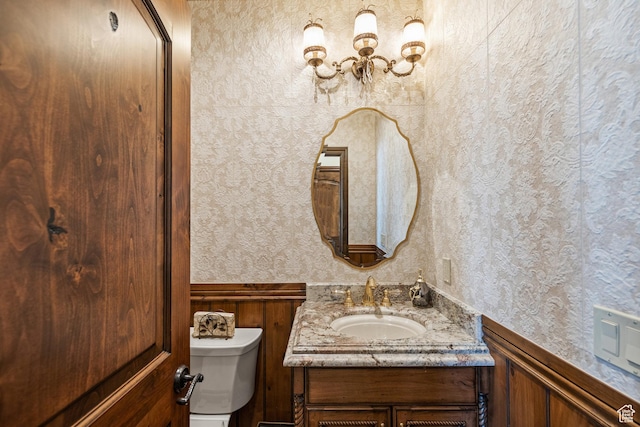 1698 S Amanda Ln E, Saratoga Springs, UT 84045 - half bathroom with toilet, wallpapered walls, and vanity