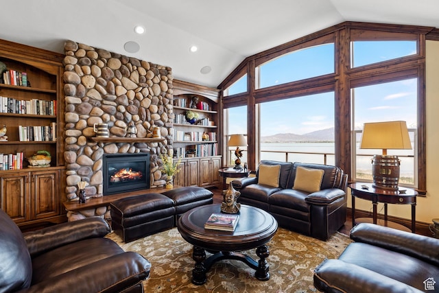 1698 S Amanda Ln E, Saratoga Springs, UT 84045 - living room with built in features, lofted ceiling, a water view, and a stone fireplace