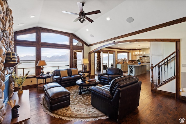 1698 S Amanda Ln E, Saratoga Springs, UT 84045 - living area with dark wood-style floors, arched walkways, crown molding, and lofted ceiling