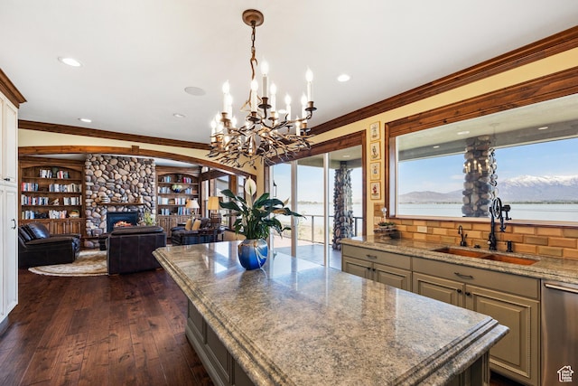 1698 S Amanda Ln E, Saratoga Springs, UT 84045 - kitchen with dishwasher, dark wood-style floors, ornamental molding, a fireplace, and a sink