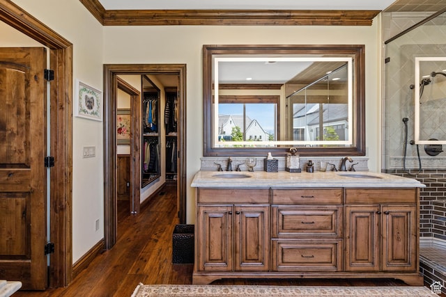 1698 S Amanda Ln E, Saratoga Springs, UT 84045 - full bathroom featuring ornamental molding, tiled shower, a sink, and wood finished floors
