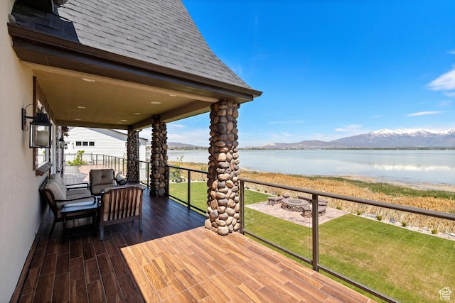 1698 S Amanda Ln E, Saratoga Springs, UT 84045 - wooden deck featuring a lawn, a fire pit, and a water and mountain view