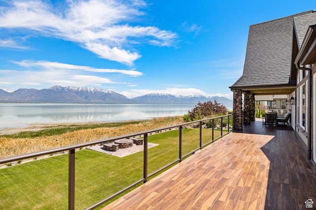 1698 S Amanda Ln E, Saratoga Springs, UT 84045 - exterior space with a yard, a fire pit, and a water and mountain view