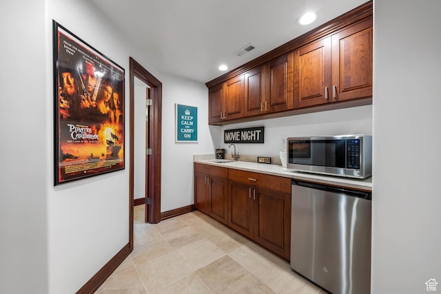 290 E 200 S, Parowan, UT 84761 - interior space featuring light countertops, stainless steel microwave, visible vents, a sink, and fridge
