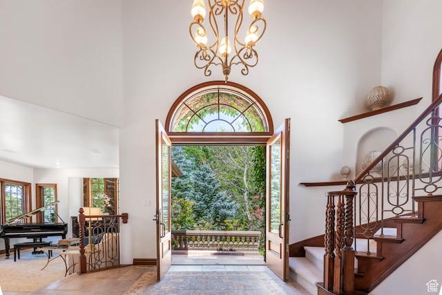290 E 200 S, Parowan, UT 84761 - entryway featuring a towering ceiling, stone finish flooring, stairway, and a chandelier