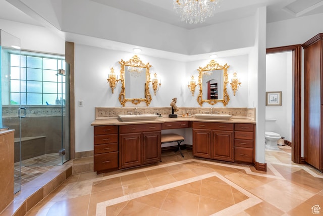 290 E 200 S, Parowan, UT 84761 - full bathroom with toilet, a sink, baseboards, double vanity, and a stall shower