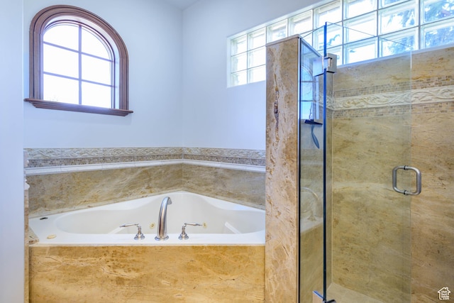 290 E 200 S, Parowan, UT 84761 - bathroom featuring a stall shower, a jetted tub, and a healthy amount of sunlight