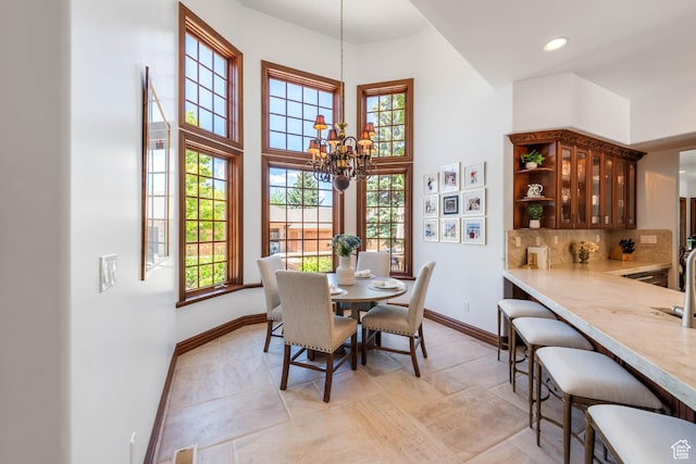 290 E 200 S, Parowan, UT 84761 - dining space featuring recessed lighting, visible vents, baseboards, a towering ceiling, and an inviting chandelier