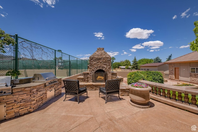 290 E 200 S, Parowan, UT 84761 - view of patio featuring area for grilling, an outdoor stone fireplace, grilling area, and fence