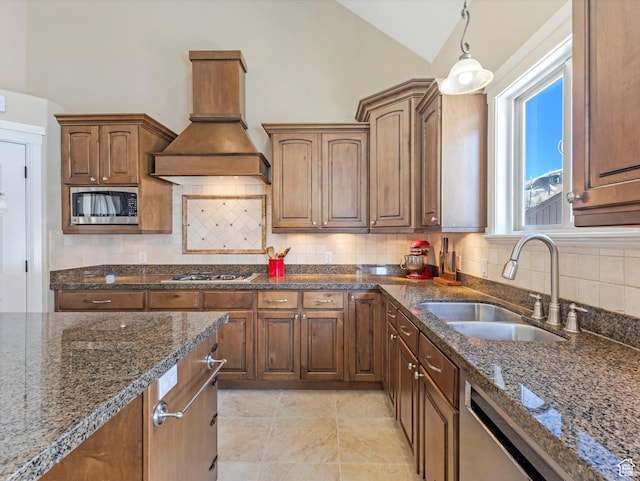 5204 N Eagles View Dr N, Lehi, UT 84043 - kitchen featuring appliances with stainless steel finishes, vaulted ceiling, a sink, premium range hood, and dark stone counters