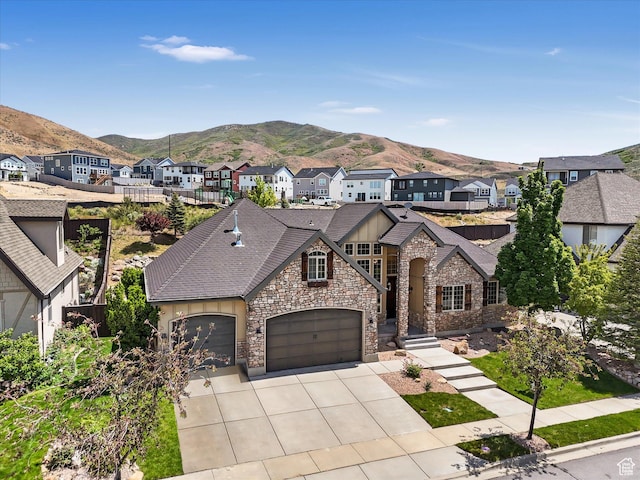 5204 N Eagles View Dr N, Lehi, UT 84043 - view of front of home featuring a mountain view, stone siding, a residential view, and concrete driveway