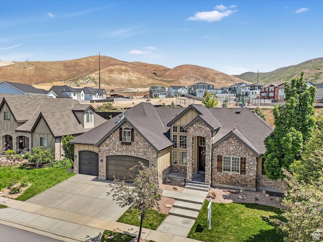 5204 N Eagles View Dr N, Lehi, UT 84043 - view of front of property with stone siding, board and batten siding, a residential view, a mountain view, and driveway