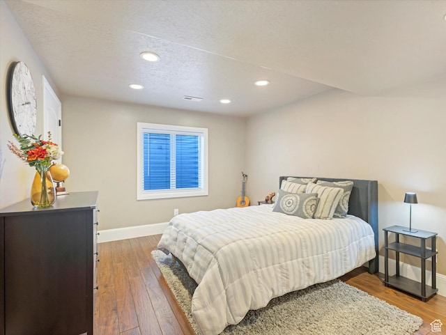 5204 N Eagles View Dr N, Lehi, UT 84043 - bedroom featuring baseboards, recessed lighting, wood finished floors, and a textured ceiling