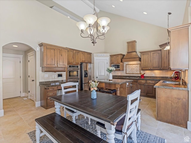 5204 N Eagles View Dr N, Lehi, UT 84043 - dining space featuring high vaulted ceiling, arched walkways, a chandelier, light tile patterned floors, and baseboards