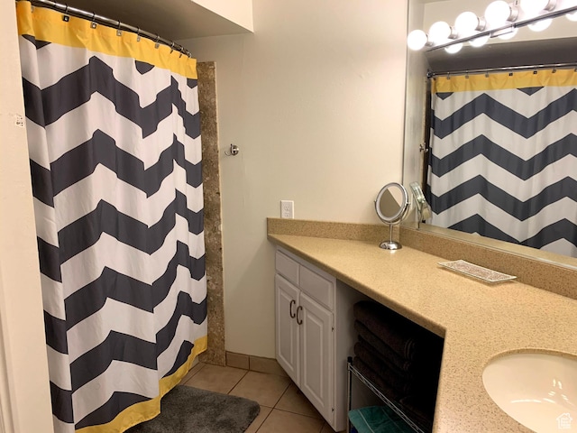 full bathroom with a shower with curtain, vanity, and tile patterned floors