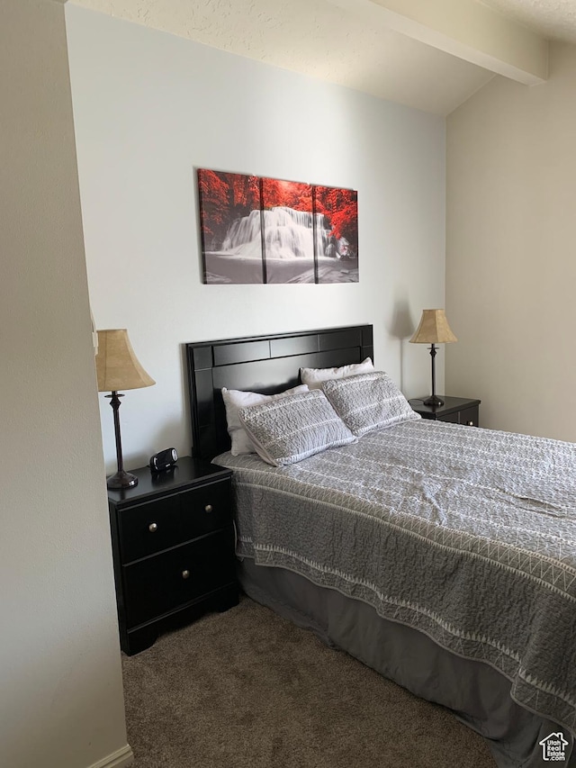 bedroom featuring vaulted ceiling with beams and carpet flooring