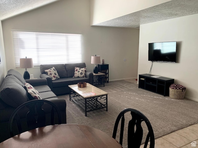 tiled living room with lofted ceiling, carpet flooring, a textured ceiling, and baseboards