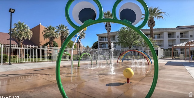 view of jungle gym with fence